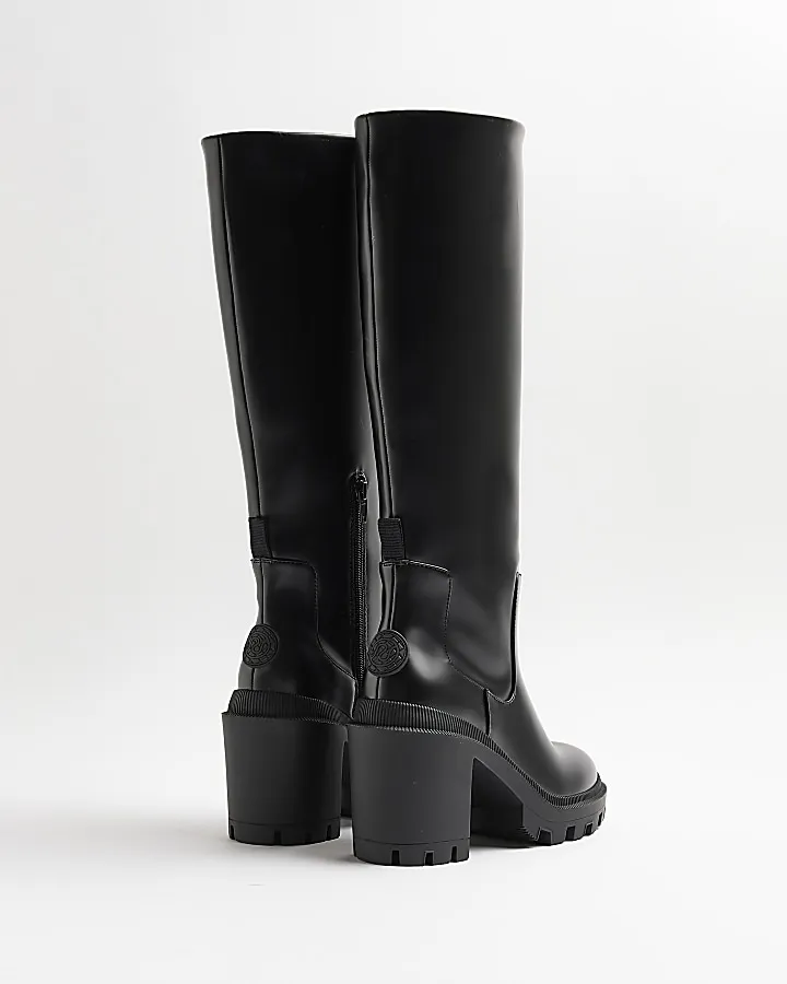 Black heeled knee high boots